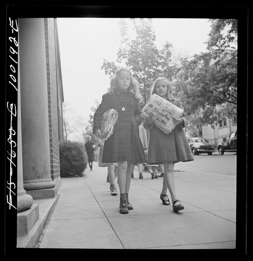 Untitled photo, possibly related to: Washington, D.C. Scrap salvage campaign, Victory Program. Children bringing their weekly contribution of scrap paper to school