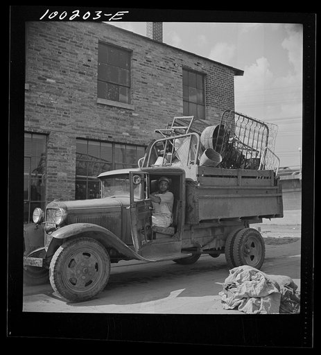 Washington, D.C. Scrap salvage campaign, Victory Program. Truck loaded with scrap metal is weighed on platform scale before being unloaded in wholesale junkyard