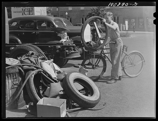 Untitled photo, possibly related to: Washington, D.C. Cyclist contributes to rubber salvage pile at Georgia Avenue