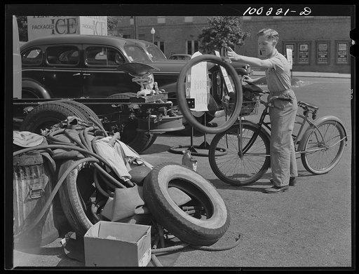 Washington, D.C. Cyclist contributes to rubber salvage pile at Georgia Avenue