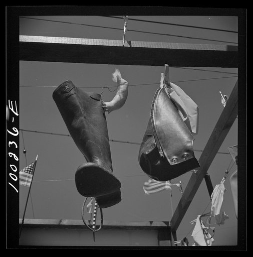 Untitled photo, possibly related to: Washington, D.C. Jar rings, torn bathing cap, doll's leg, boot, boy's rain hat, hose in rubber salvage display at "Call Carl" filling station on Georgia Avenue