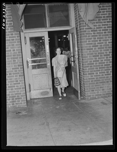 Washington, D.C. Shopper leaving the Giant Food shopping center on Wisconsin Avenue