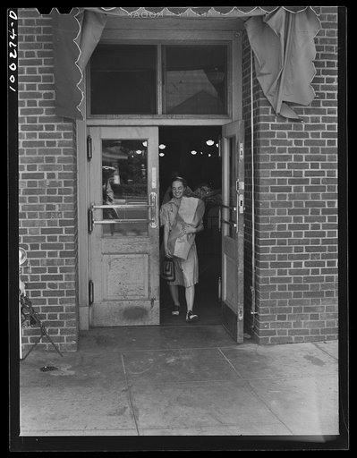 Untitled photo, possibly related to: Washington, D.C. Shopper leaving the Giant Food shopping center on Wisconsin Avenue