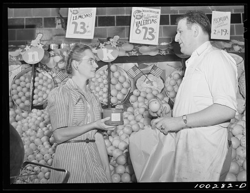 Untitled photo, possibly related to: Washington, D.C. Inquiring of a salesman why fruit and vegetables have no ceiling price, while coffee does