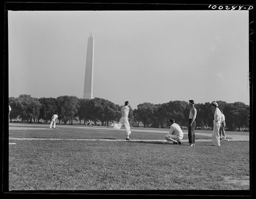 Untitled photo, possibly related to: Washington, D.C. Amateur baseball games are held daily on fields near the Washington Monument, between rival governmental departments, employees of restaurants, garages, etc.