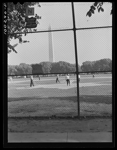 Untitled photo, possibly related to: Washington, D.C. Amateur baseball games are held daily on fields near the Washington Monument, between rival governmental departments, employees of restaurants, garages, etc.