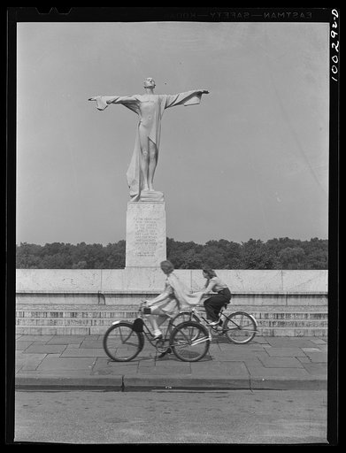 Washington, D.C. Bicycling on Sunday in East Potomac Park, in front of the statue erected to the memory of the victims of the Titanic