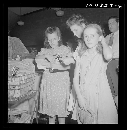Washington, D.C. Customers getting out their sugar ration cards in the Giant Food shopping center on Wisconsin Avenue