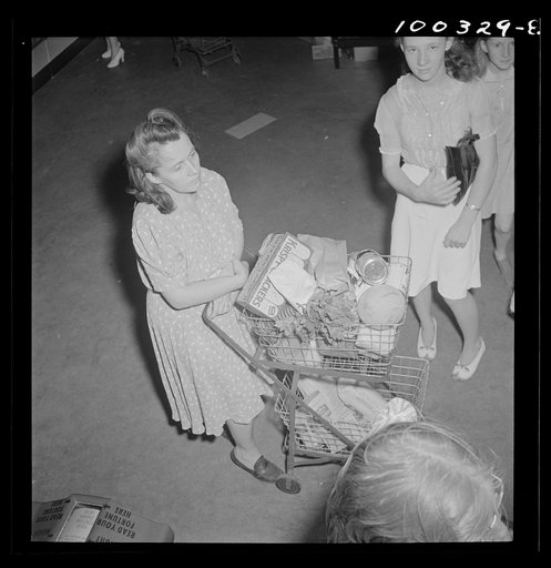 Washington, D.C. Shopper waiting in line at a cashier's booth in the Giant Food shopping center