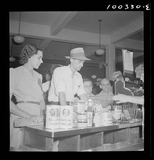 Washington, D.C. Cashier checking out a customer's purchases at the Giant Food shopping center