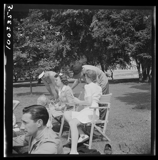 Untitled photo, possibly related to: Washington, D.C. Audience of wives watching their husbands play amateur baseball on a diamond near Lincoln Memorial on Sunday. Woman in the rear left is keeping score