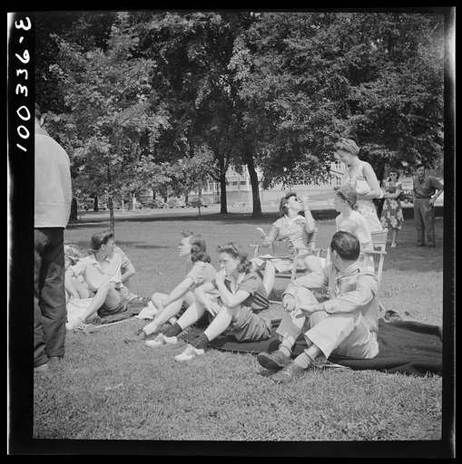 Washington, D.C. Audience of wives watching their husbands play amateur baseball on a diamond near Lincoln Memorial on Sunday. Woman in the rear left is keeping score