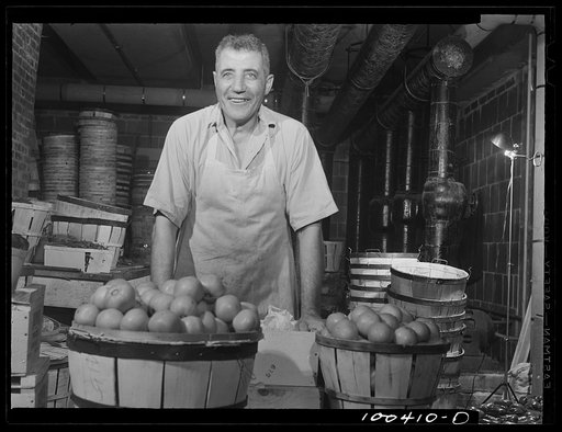 Untitled photo, possibly related to: Washington, D.C. District grocery store warehouse on 4th Street S.W. This man is a sorter. He grades fruits and vegetables and throws out spoiled ones