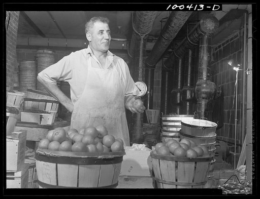 Washington, D.C. District grocery store warehouse on 4th Street S.W. This man is a sorter. He grades fruits and vegetables and throws out spoiled ones