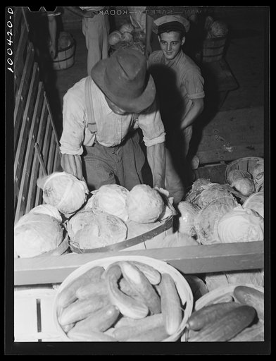 Untitled photo, possibly related to: Washington, D.C. District grocery store warehouse on 4th Street S.W. Unloading cabbages and spinach