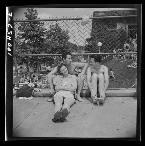 Washington, D.C. Relaxing on the edge of the municipal swimming pool on Sunday