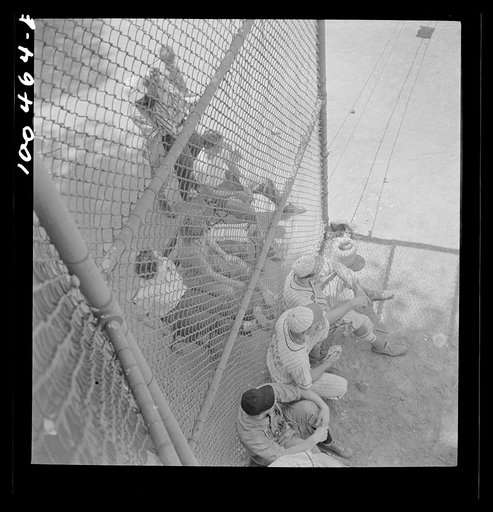 Washington, D.C. Players and spectators in a baseball game at the Ellipse