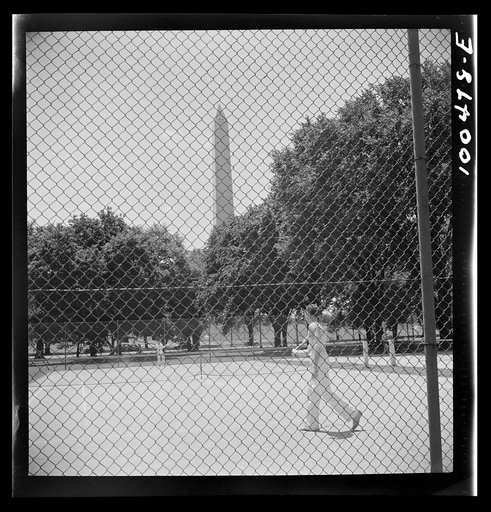Washington, D.C. Playing tennis in the park in front of the U.S. Department of Commerce building on Sunday afternoon