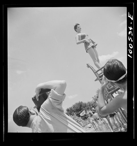 Untitled photo, possibly related to: Washington, D.C. Publicity photographer and model at the municipal swimming pool on Sunday