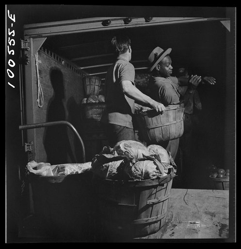 Untitled photo, possibly related to: Washington, D.C. Unloading potatoes and cabbage at the District grocery store warehouse