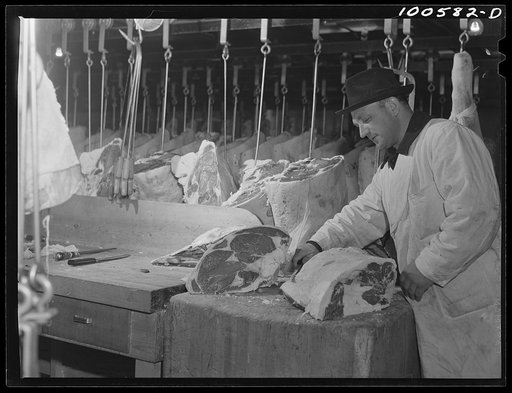 Washington, D.C. Cutting beef in the District grocery store warehouse