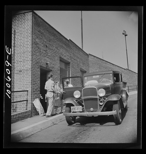 Untitled photo, possibly related to: Washington, D.C. Loading groceries into a car at the Giant Food shopping center on Wisconsin Avenue