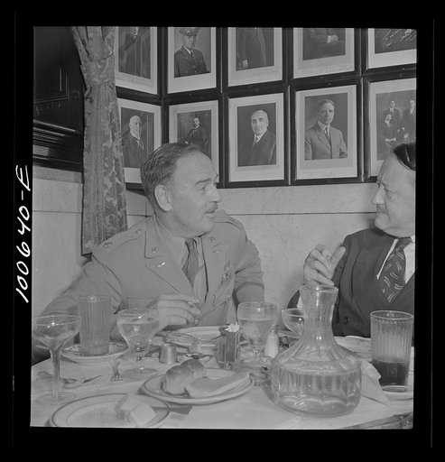 Washington, D.C. U.S. Army Corps major and a civilan lunching at the Occidental Hotel restaurant