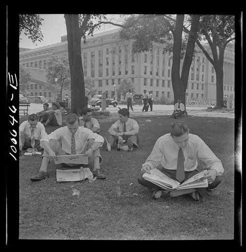 Washington, D.C. Government workers lunching and resting in Washington Monument park outside the U.S. Department of Agriculture