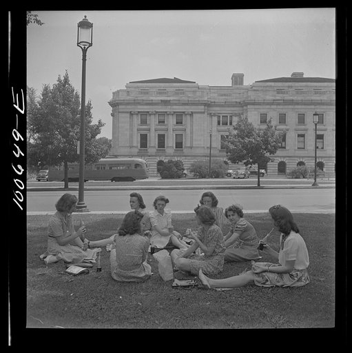 Untitled photo, possibly related to: Washington, D.C. Government workers lunch outside the U.S. Department of Agriculture in Washington Monument park