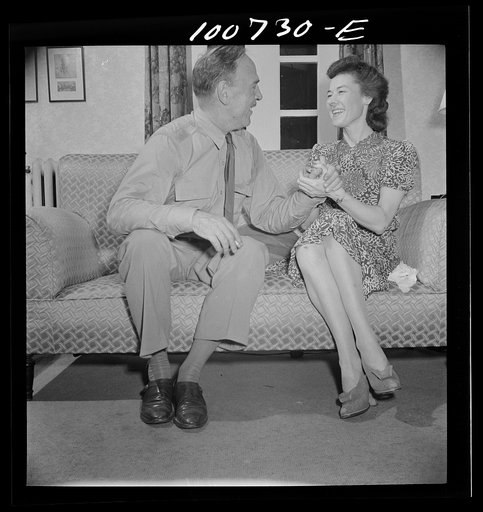 Washington, D.C. U.S. Army Air Corps major about to leave to take over a Libyan bomber command, with a New York department store executive visiting in Washington