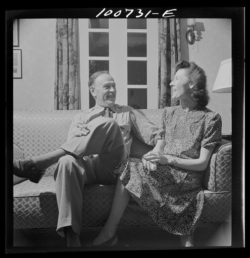 Untitled photo, possibly related to: Washington, D.C. U.S. Army Air Corps major about to leave to take over a Libyan bomber command, with a New York department store executive visiting in Washington