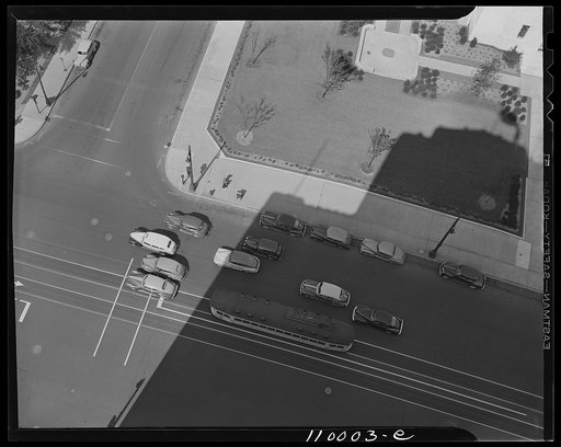 Detroit, Michigan. Cars waiting for a traffic light on a street with traffic markings