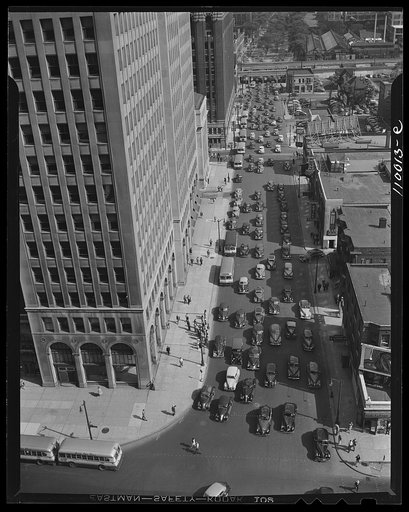 Detroit, Michigan. Typical Detroit traffic scene at 5:30 taken from the Fisher Building with the General Motors Building at the left