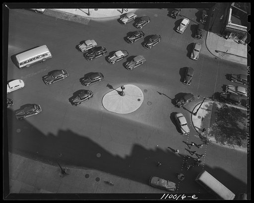 Untitled photo, possibly related to: Detroit, Michigan. A traffic control island around which the traffic moves in several directions