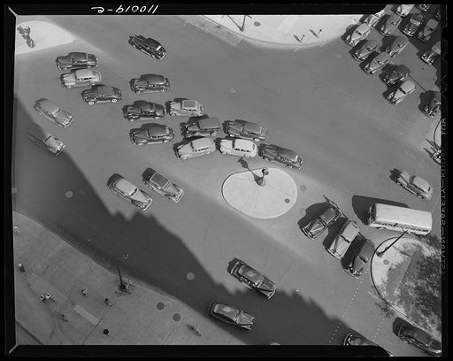 Detroit, Michigan. A traffic control island around which the traffic moves in several directions