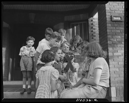 Detroit, Michigan. Children with a bird