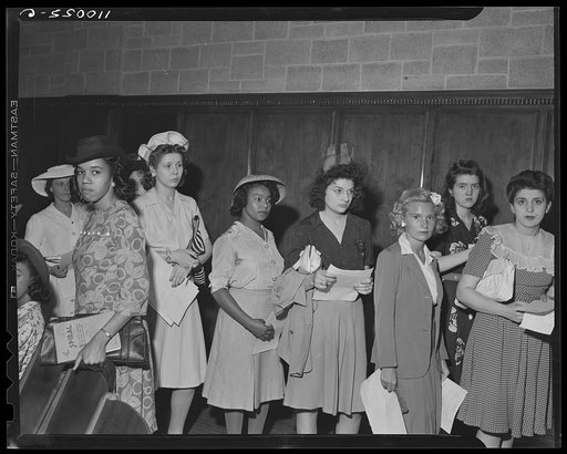 Detroit, Michigan. White and Negro youths line up to register for the salvage drive