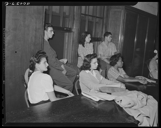 Detroit, Michigan. Youths listening to speakers at a salvage committe meeting