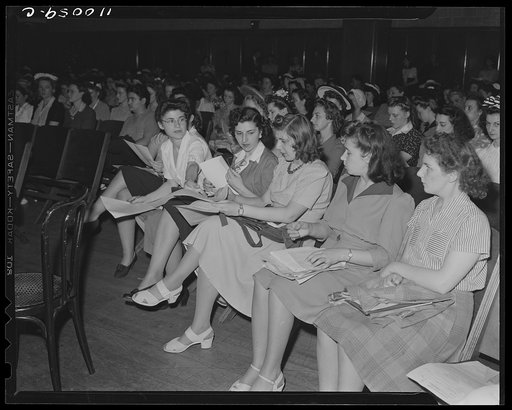 Detroit, Michigan. Passing out forms at a salvage meeting