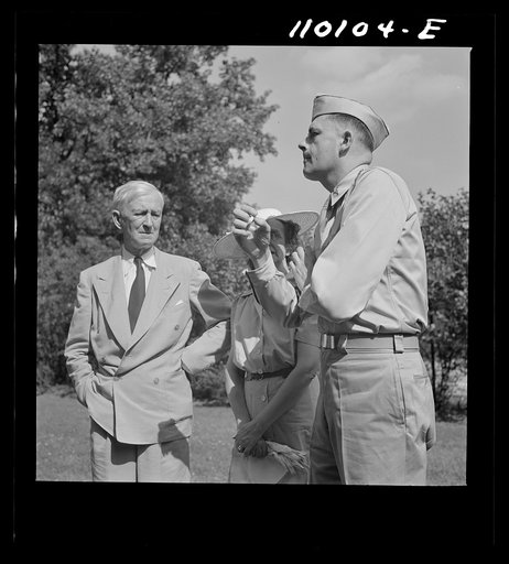 Detroit, Michigan. Flag presentation ceremonies at Harper Hospital. Doctor with his parents