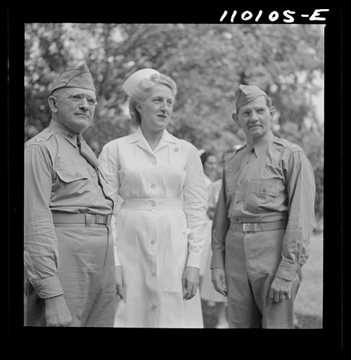 Untitled photo, possibly related to: Detroit, Michigan. Flag presentation ceremonies at Harper Hospital. Colonel Carstens and Major Spaulding with the head nurse