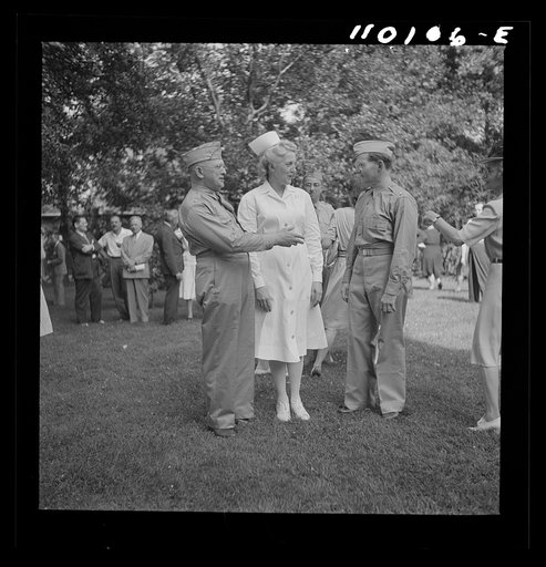 Detroit, Michigan. Flag presentation ceremonies at Harper Hospital. Colonel Carstens and Major Spaulding with the head nurse