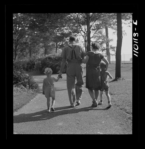 Detroit, Michigan. Worker and family in the zoological park