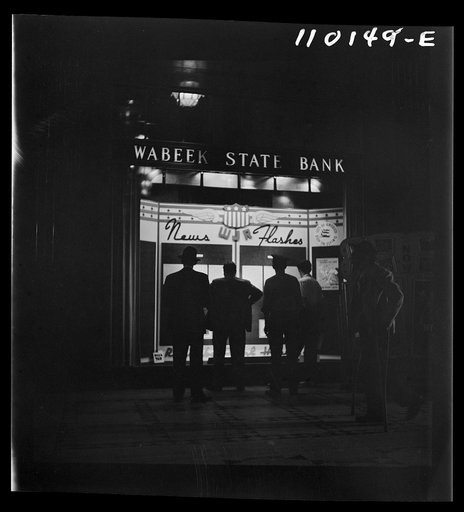 Untitled photo, possibly related to: Detroit, Michigan. Spectators watching news flashes in a window