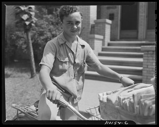 Untitled photo, possibly related to: Detroit, Michigan. Newsboy delivering papers