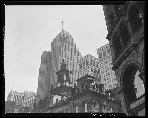 Detroit, Michigan. Top of Detroit's city hall dwarfed by the modern Penobscot Building in the background