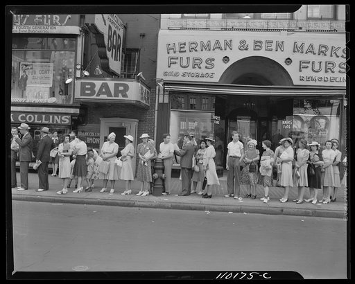 Detroit, Michigan. People lined up waiting for a bus at 5 o'clock