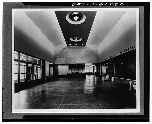 Chickamauga Dam and powerhouse. Reception room, looking upstream. Glass wall at end of room overlooks reservoir; platform raised two steps for better view across deck of dam. Glass wall at left overlooks generator hall; doors at right offer view of switchyard. Niche beyond set of doors, empty at the