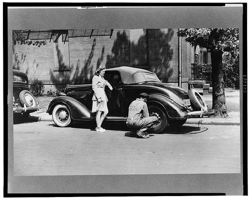 Girl having her tire changed in Southeast Washington