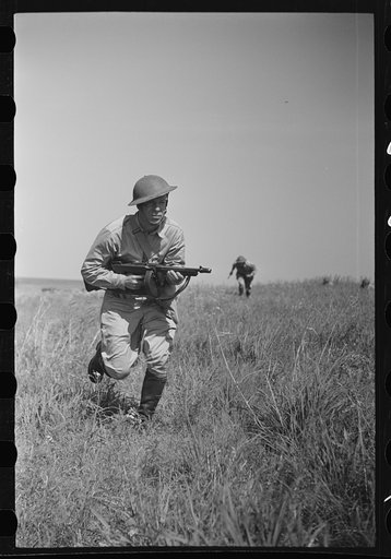 Fort Riley, Kansas. Soldiers of a mechanized reconnaissance unit during a simulated dismounted attack